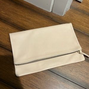 Pinky cream beige leather foldover pouch clutch from Everlane
